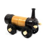 A rare vegetable ivory and rosewood crochet case in the form of a steam locomotive, pierced