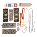 A selection of 19th Century beadwork jewellery comprising two pairs of bracelets/cuffs one pair with