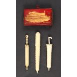 Four needle cases/containers comprising an ivory stacked brick cylinder needle case, slight loss