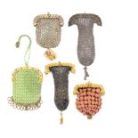 Five 19th Century small format purses, three with fancy gilt metal clasps and two with white metal