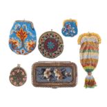 Six small format 19th Century beadwork purses comprising a steel frame wallet form example with