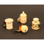 Four bone and ivory tape measures comprising an acorn form example, printed tape marked in nails and