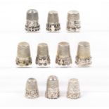 Ten silver and white metal English and continental thimbles mostly with applied decorative