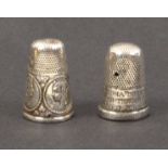 Two English silver commemorative thimbles, one with oval portrait medallions of Queen Victoria and
