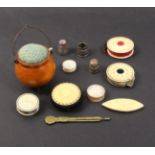 A mixed lot - sewing - comprising four bone disc form pin cushions, two with cut out centres,
