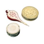 Three 19th Century pin cushions, comprising a pierced bone example as a set of bellows, 6.6cm, an