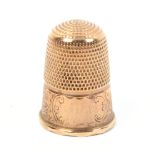 A 9ct gold thimble by Charles Horner, scroll and flower engraved frieze, Chester, 1913