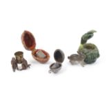 Four thimble cases comprising a continental painted cast metal example in the form of a rabbit