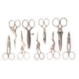 Nine pairs of steel scissors comprising five button holing examples and four in the form of