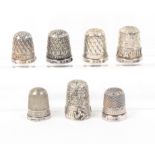 Seven silver thimbles with inscribed friezes, Isle of Man, holed/Blackpool/Bournemouth/Andrews Liver