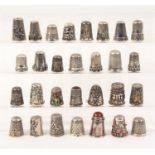 Twenty nine silver and white metal thimbles English and continental, some with damage (29)