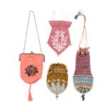 Four 19th Century small format bags and purses part decorated in beadwork comprising a French