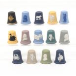 Fourteen Wedgwood Jasper ware thimbles in a variety of colours and with various appliques (14)