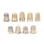 Nine English silver 20th Century hallmarked thimbles all with decorative borders and crisply