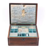 An early Victorian rosewood sewing box of rectangular form the front with pewter line inlay, the lid