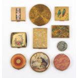 Ten vintage powder compacts, the largest example circular and decorated with fish, mermaids etc, and