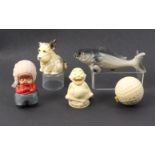 Five novelty celluloid tape measures comprising an imp style seated figure titled 'Lucky Joy