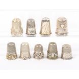 Nine white metal and silver thimbles, English, American, Continental including an example with