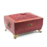 A Regency red grained morocco sewing box of sarcophagal form, the lid with radiating fan segments