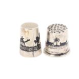 Two white metal Marsh Arab thimbles with Niello decoration, one with boat, camel and trees, the