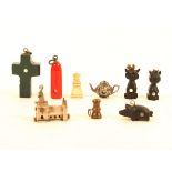 Nine charms or similar items with Stanhopes comprising a bog oak cat, (multiple views - Memory of