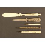 Five pen and pencil Stanhopes comprising a pierced bone paper knife (six views - Memory Of