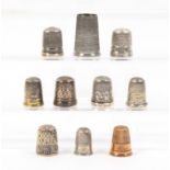 Ten thimbles mostly silver, including inscribed border 'Bournemouth', 'Stratford-On-Avon/The