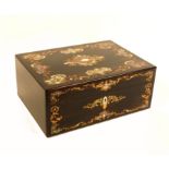 An early Victorian coromandel wood fully fitted sewing box of rectangular form, the lid and front