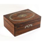 A mid Victorian rosewood sewing box of rectangular form, the lid with cut mother of pearl oval and