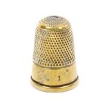 A Victorian brass Stanhope thimble (A Memory of Westgate On Sea - six views) plain frieze with