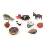 Nine pin cushions and emeries comprising two fruit emeries, three natural shell pin cushions another