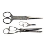Three pairs of steel scissors comprising a pair with diamond form tapering blades, the arms