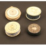 Four pin cushions all of disc form comprising an ivory example carved to each side, one with
