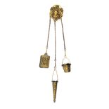 A late Victorian brass chatelaine, the clip stamped 'Pat App For', female mask mount, three chains