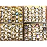 A large collection of modern thimbles mostly ceramic and arranged in six boxes, together with
