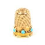 A Victorian gold thimble, the frieze with six turquoise coloured stones within wire work mounts