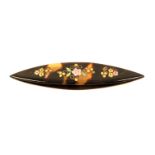 An inlaid tortoiseshell tatting shuttle, one side inlaid in brass and mother of pearl flowers and