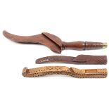 Three 19th Century wooden knitting sticks and sheaths comprising a fruitwood example probably Dent