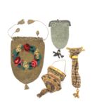 Four 19th Century small format purses comprising a circular section example worked in metal beads