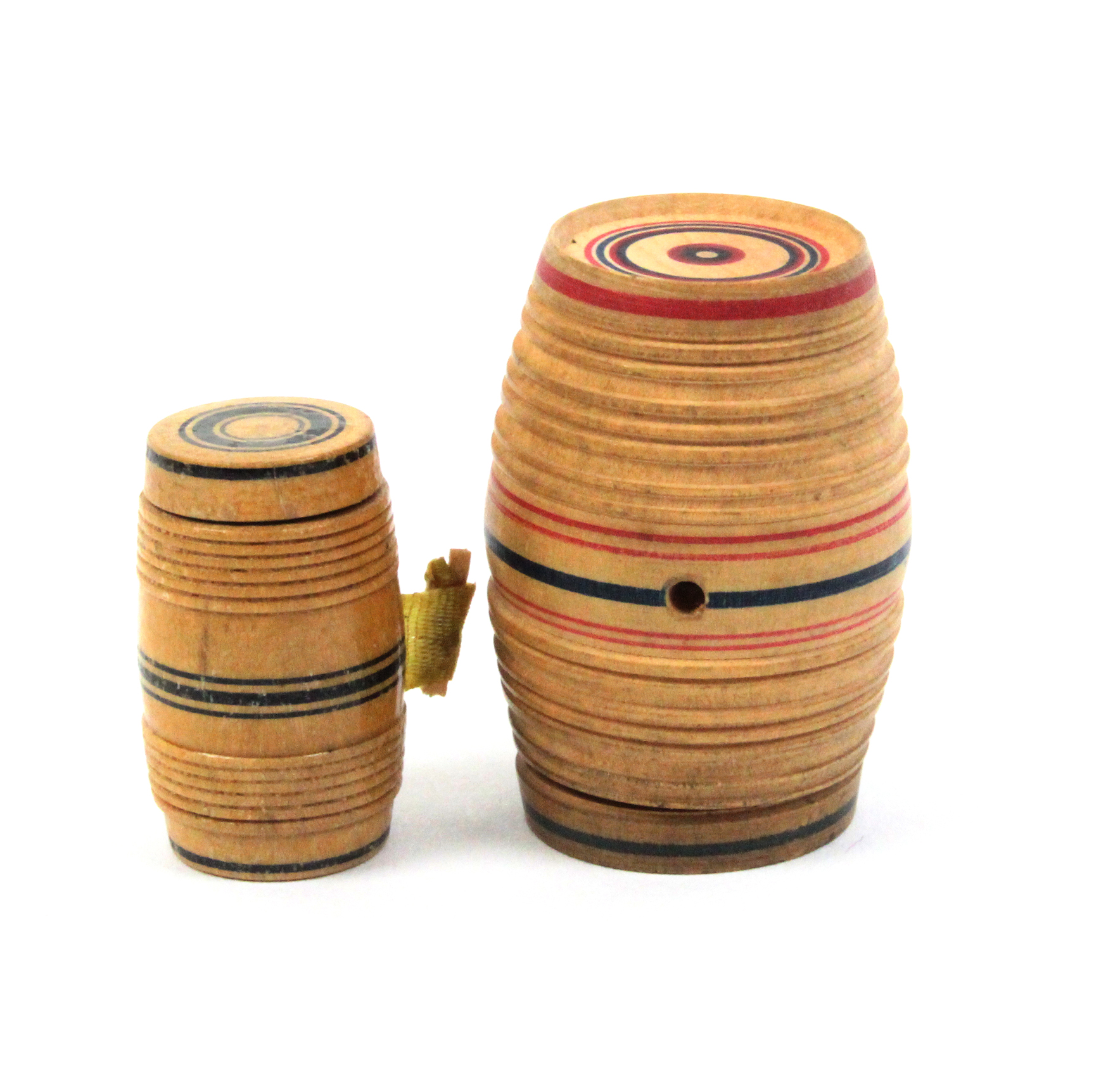 Two pieces of painted whitewood Tunbridge ware comprising a barrel form tape measure, 2.7cm, the