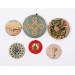 Six pin wheels comprising a large floral needlework example, 7cm, another of geometric pattern, 7.