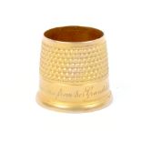 A 9ct gold Victorian open top thimble by James Fenton the frieze engraved 'To Dear Grandma From