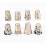 Eight white metal decorative thimbles, French, Portuguese, Mexican (8)