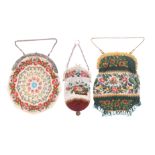 Three 19th Century beadwork bags comprising a green ground example worked with a band of flowers