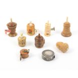 Nine tape measures comprising a bone example as a castle chess piece, tape weak, 5cm, a circular