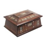 A mid-19th Century rosewood and cut mother of pearl sewing box of sarcophagus form, the lid with