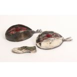 Three silver pin cushions comprising two in the form of glengarry's, Birmingham, 1909, 10cm and