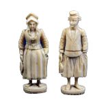 A pair of 19th Century French figural standing needle cases, probably Dieppe, one as a fisherman