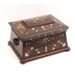 A rosewood sewing box, circa 1840, of sarcophagus form inlaid to the top and front with mother of