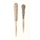 Two silver handled stilettos both with leaf scroll and floral handles, 9cm and 7.5cm (2)